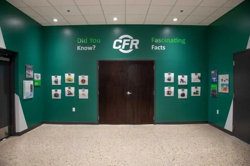 CFR History Wall displaying various graphics and images on a large, green wall.