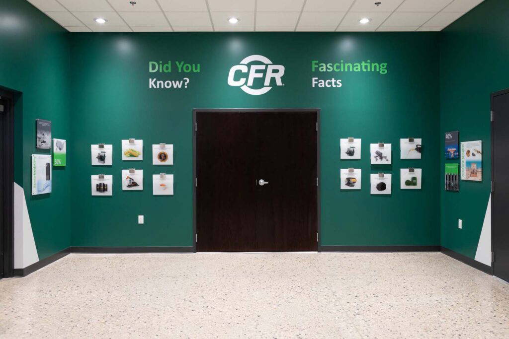 CFR History Wall displaying various graphics and images on a large green wall.