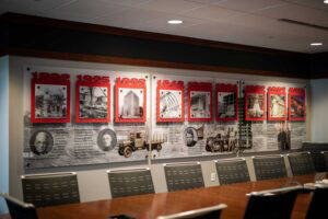 Conference room style area with historic timeline on the wall