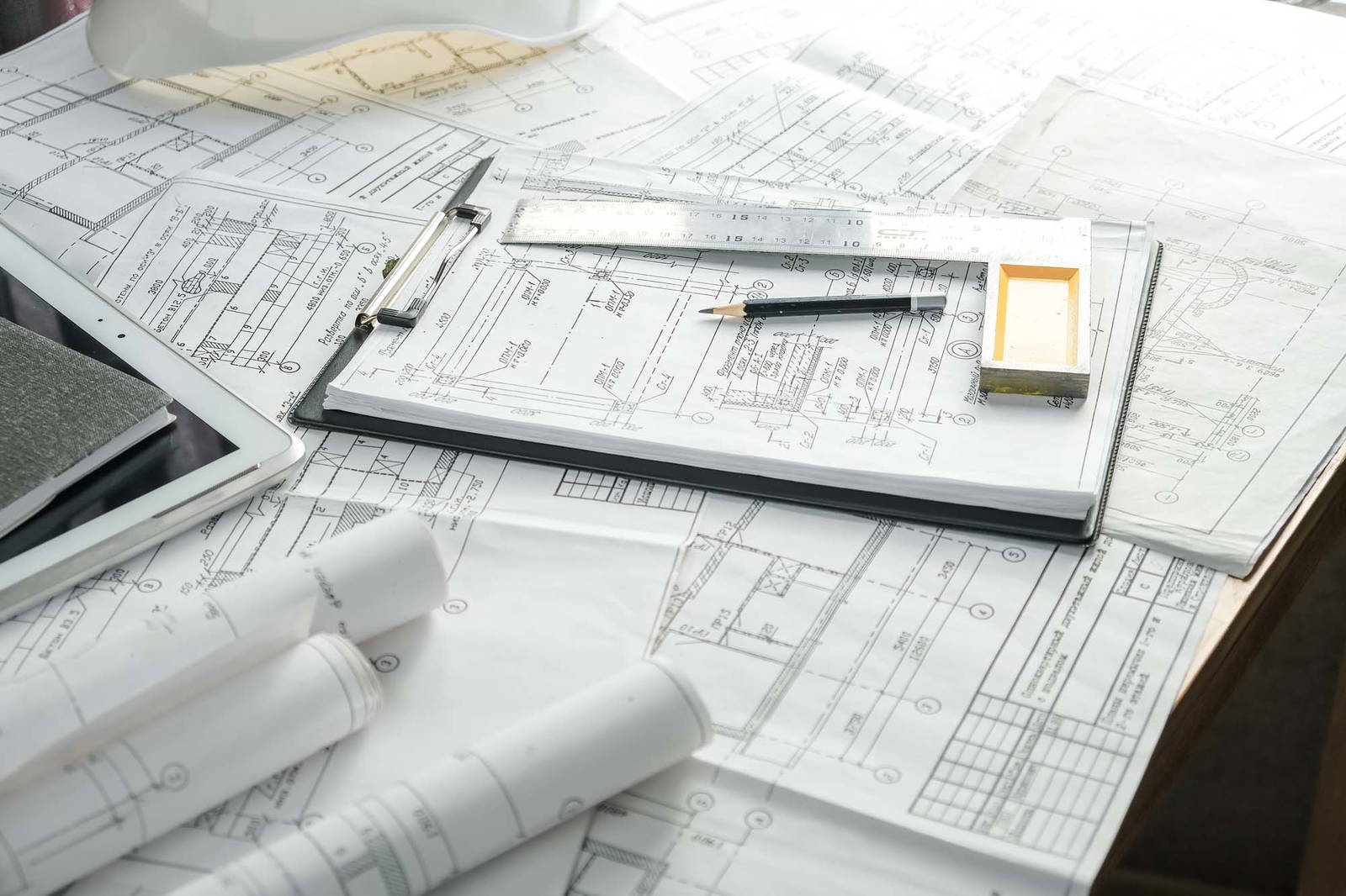 Desk with many construction documents.