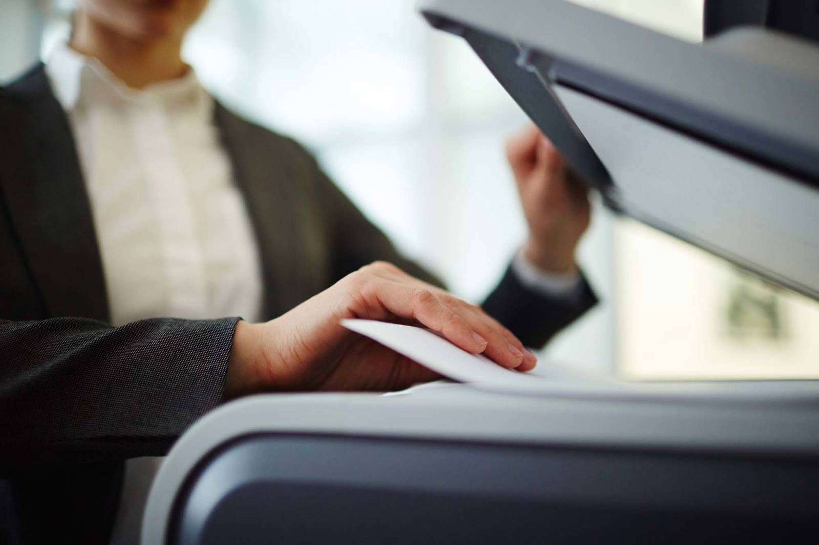 Person scanning documents.