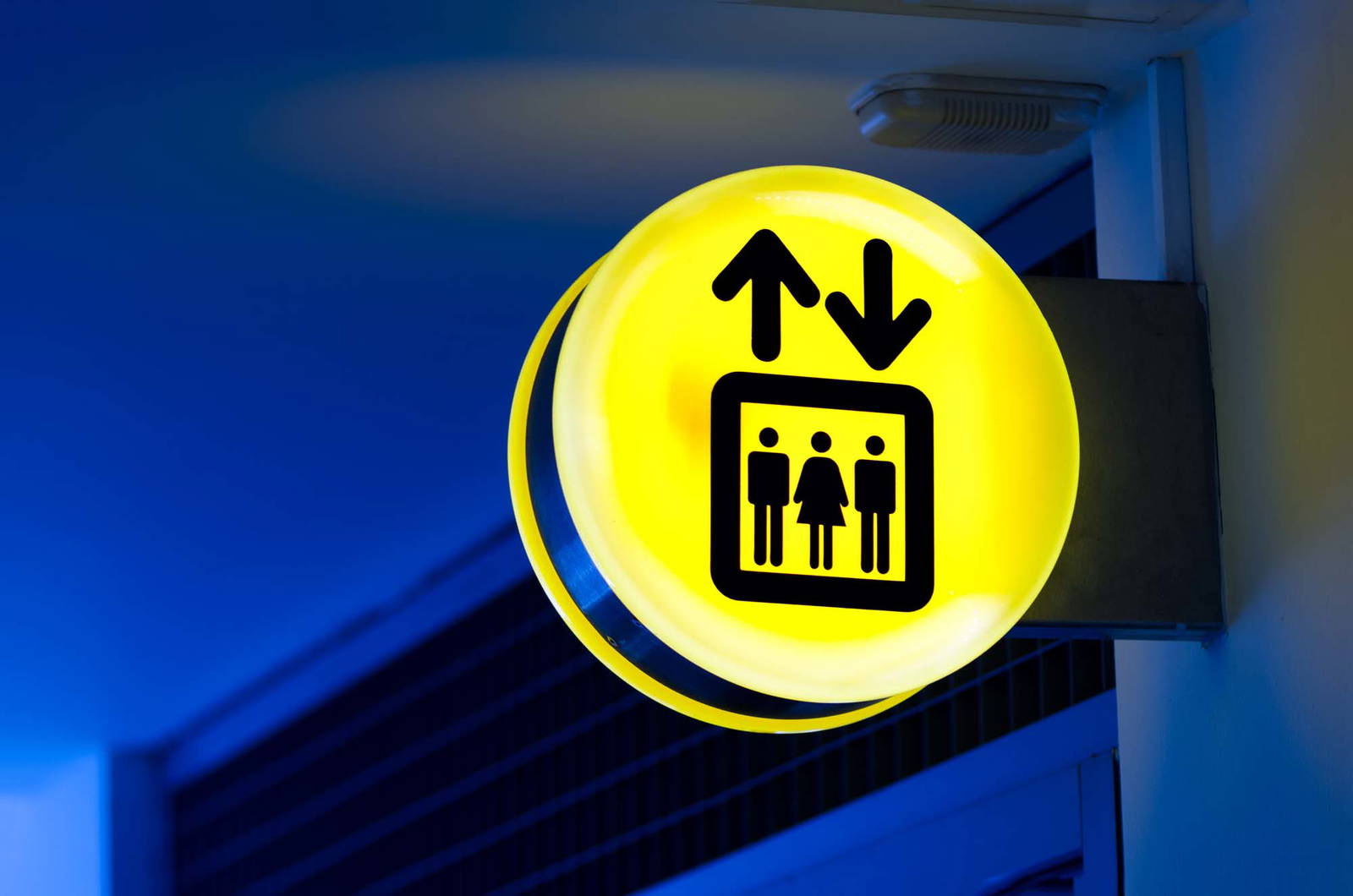 Yellow backlit wayfinding signage.
