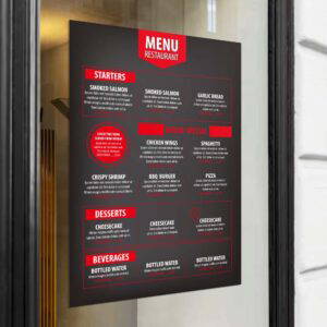 Black sign with menu details written in small, red and white text. 