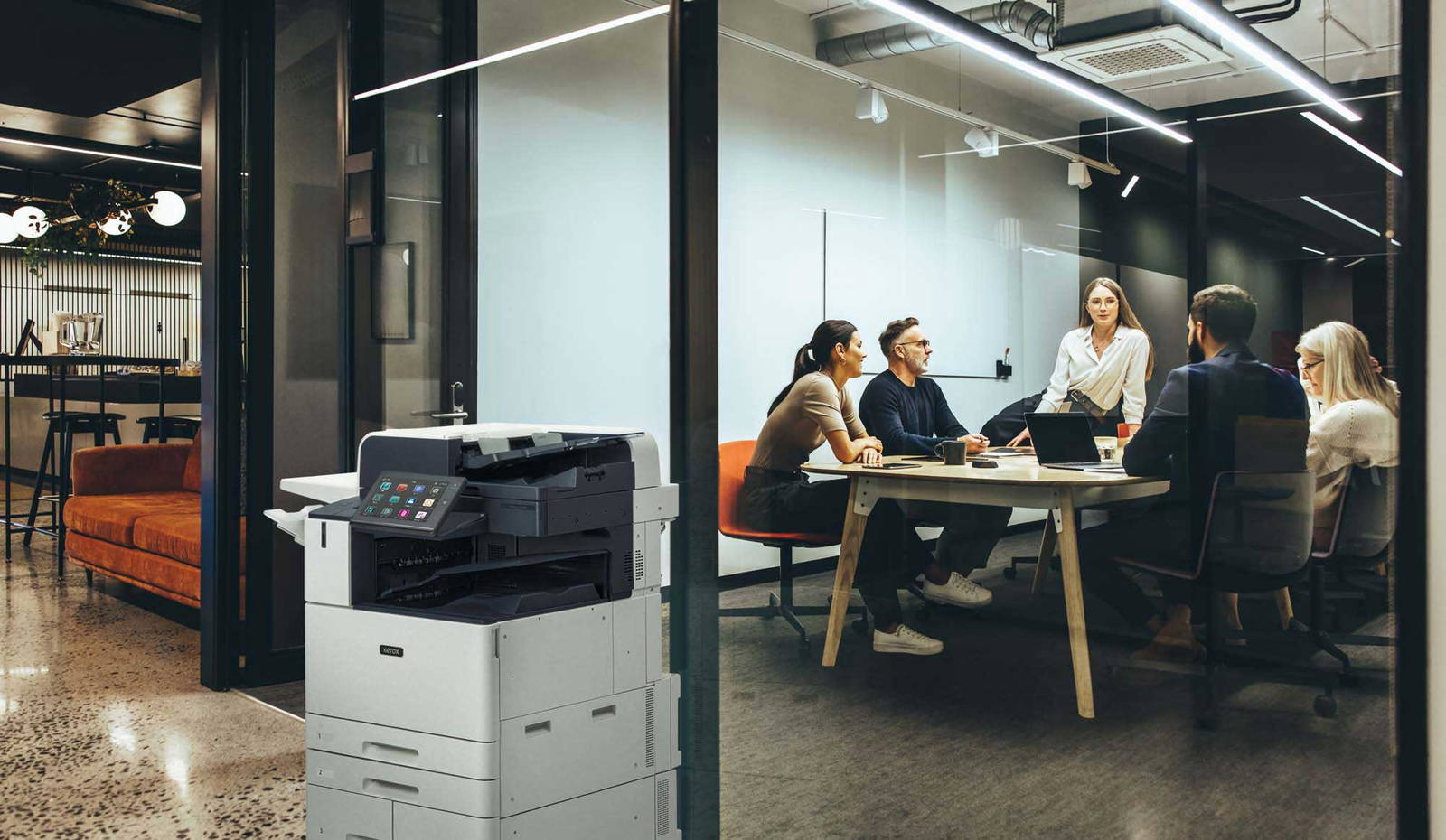 Office workers near a Xerox printer.