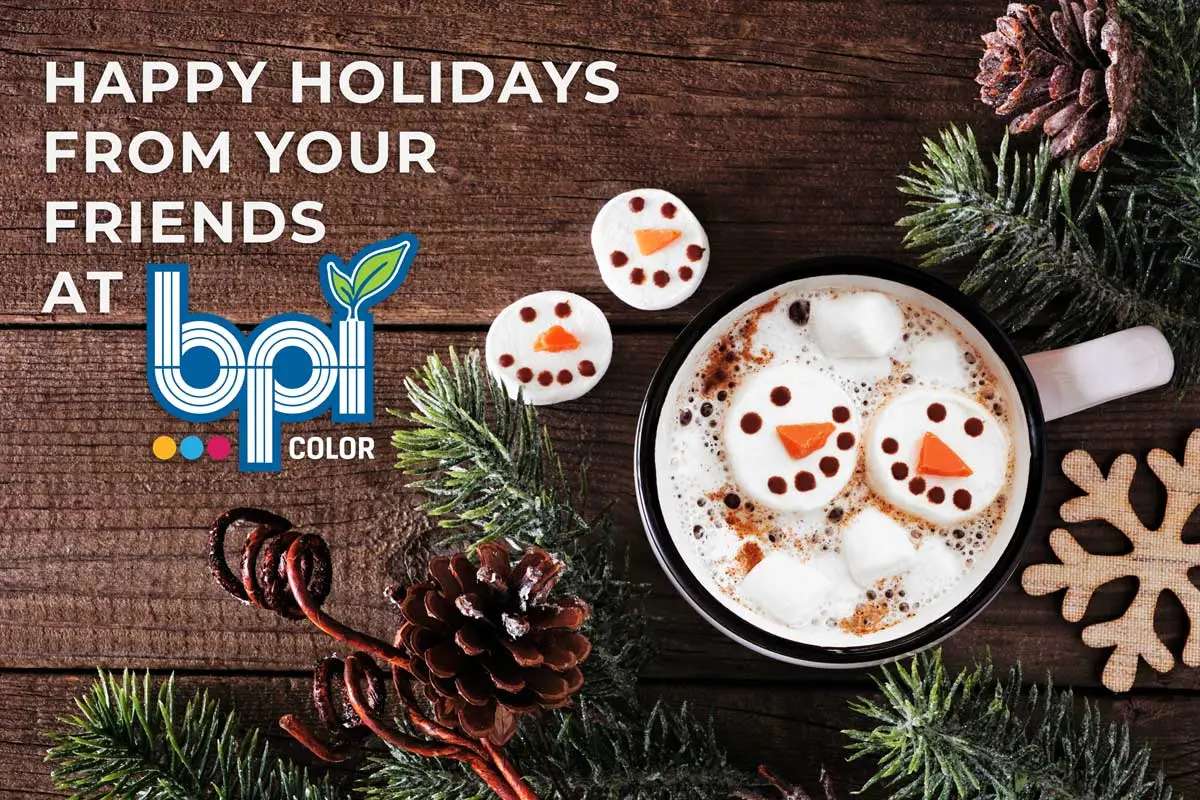 Holiday Banner featuring festive marshmallow snowmen in hot cocoa, pine cones, evergreen branches, and a holiday greeting from BPI Color.