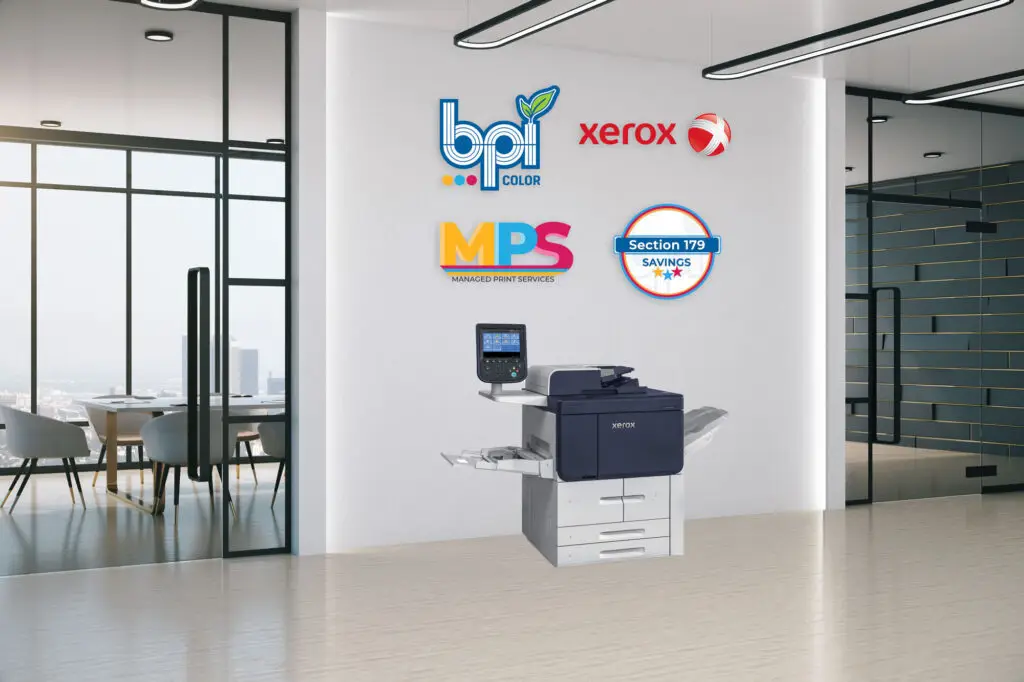 Xerox PrimeLink B9100 Series multifunction printer displayed in a modern office with BPI Color, Xerox, MPS, and Section 179 Savings logos on the wall.