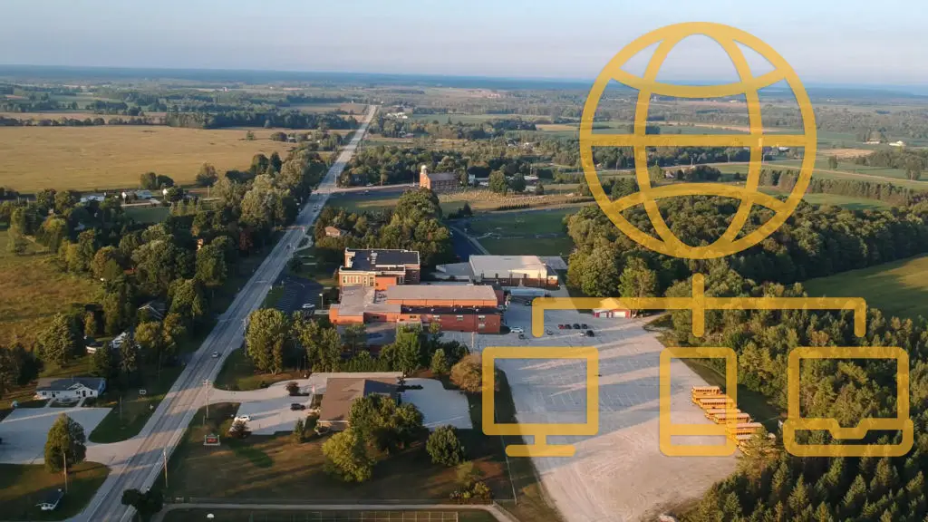 BPI Color's 2024 Year in Review 13 Sevastopol WI Fiber Network aerial view of rural school and community buildings with digital network icons overlay, representing broadband internet expansion.