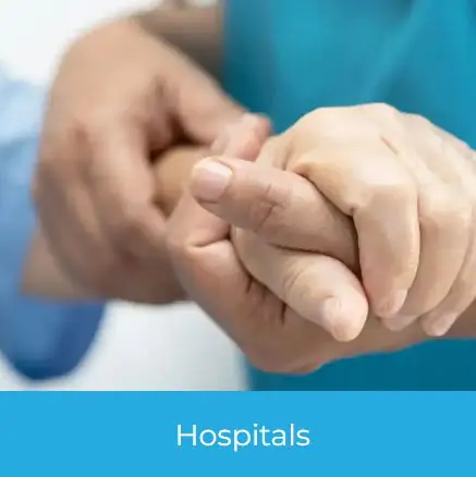 Hospital Promotional Products concept showing a healthcare worker compassionately holding a patient’s hand, representing care and support in clinical settings.