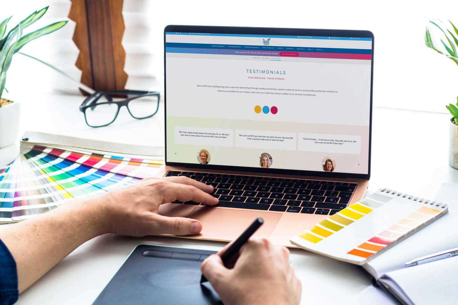 Person on a laptop view the BPI Color website.