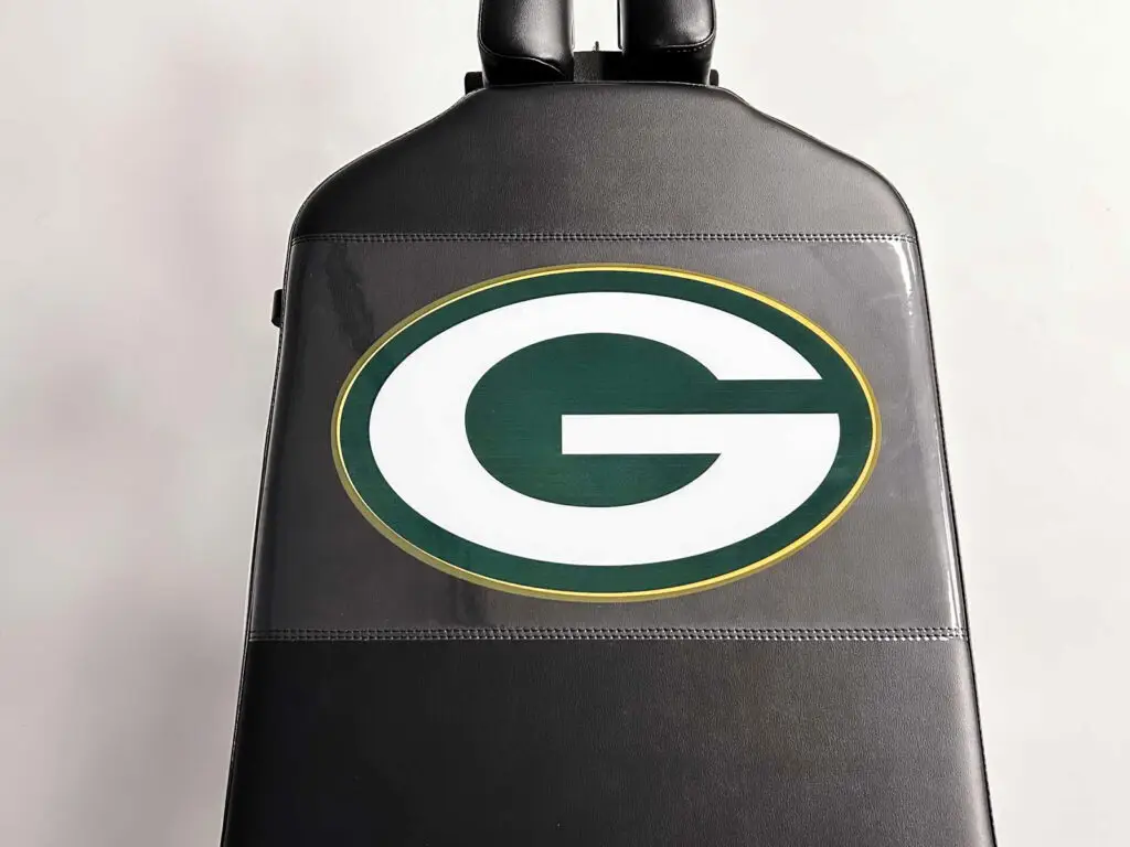 Thuli Tables athletic treatment table featuring a custom Green Bay Packers “G” logo on black upholstery.