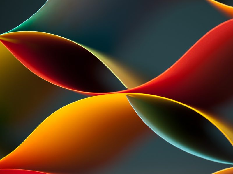 Banner Image featuring abstract curved shapes in vibrant shades of red, orange, yellow, and teal overlapping on a dark, blurred background.