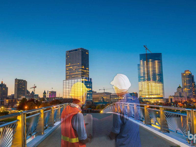 Two engineers looking at Milwuakee, WI Skyline